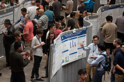 Students presenting work at a poster session