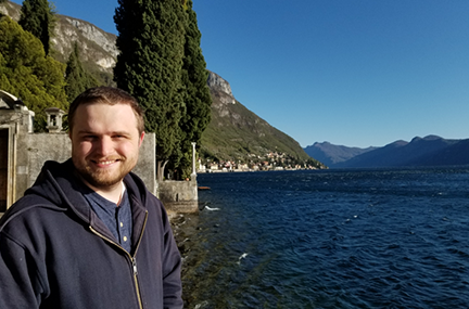 Trevor standing on a scenic coastline