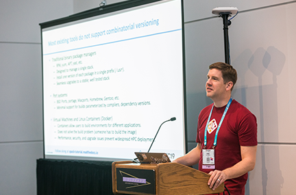 Todd at a podium delivering a talk at SC19