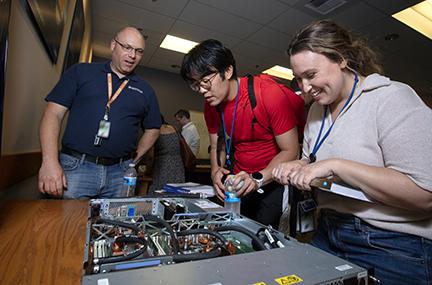 Developer Day attendees are looking down into a Sierra supercomputer cluster node.