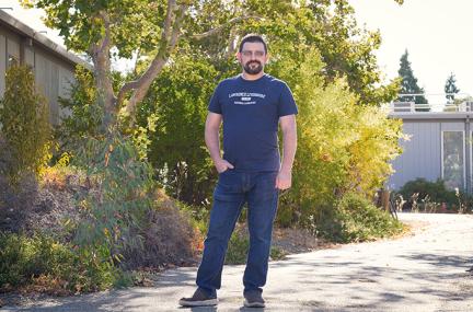 Rodrigues stands outside a building at LLNL