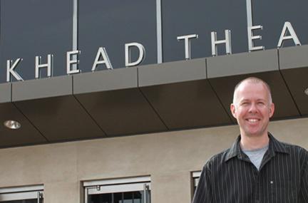 Kirk Sylvester stands outside the Bankhead Theater