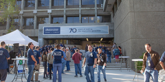 people gathering outside the main administration building