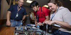 Developer Day attendees are looking down into a Sierra supercomputer cluster node.